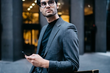 Young businessman leaning on railing and looking a 2023 12 15 17 06 27 utc