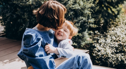 Mother with her son sitting stairs