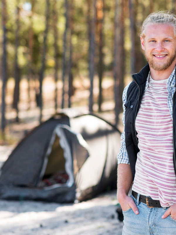 Happy man enjoying forest