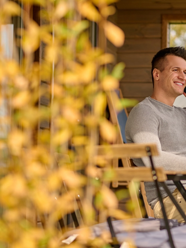 Man talking smartphone sitting open terrace