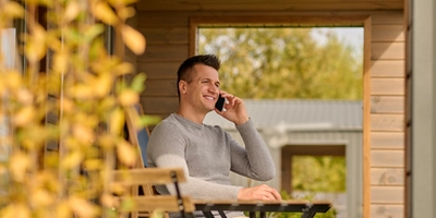 Man talking smartphone sitting open terrace