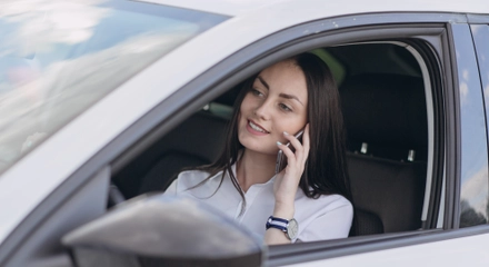Woman talking phone while driving
