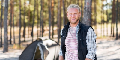 Happy man enjoying forest