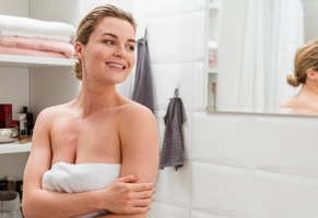 Woman towel looking away