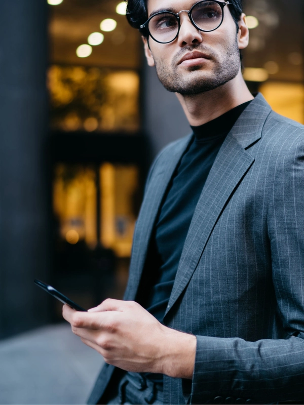 Young businessman leaning on railing and looking a 2023 12 15 17 06 27 utc