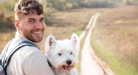 Man holding cute dog medium shot