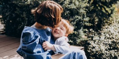 Mother with her son sitting stairs